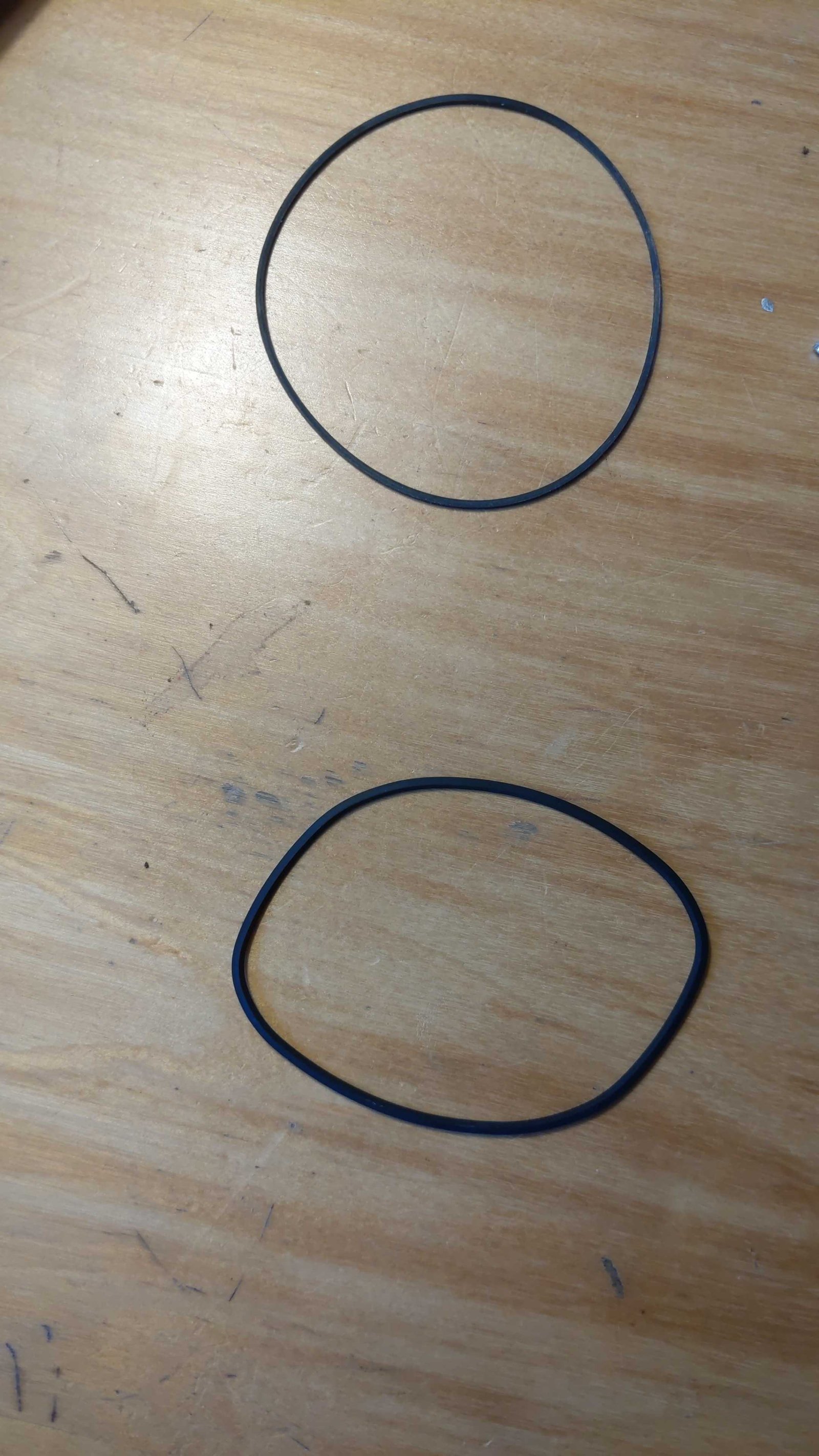 The old belt (bottom) and the new belt (top)